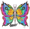 Brightly colored butterfly in tribal style with moon and stars