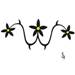 A lower back design of black flowers with yellow centres..