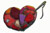 a patchwork heart (emo)  needle, thread and a heart made from patchwork...