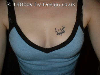 sexy girl with arabic tattoo on chest tattoo picture