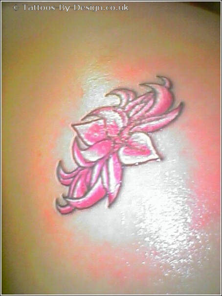 Cherry Blossom Tattoo and Lotus Tattoo Design on Female Lower Back