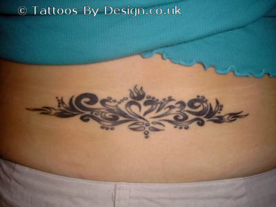lower back flower tattoos. lower back tribal tattoo for