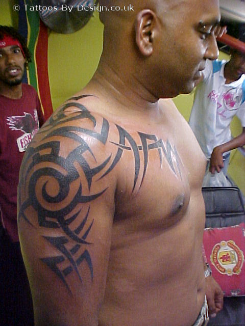 tribal tattoos chest to arm. Tribal Tattoo Arm And Chest.