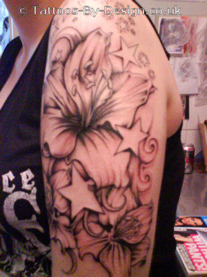 Female Tattoo With Flower Tattoo Design On The Side Neck