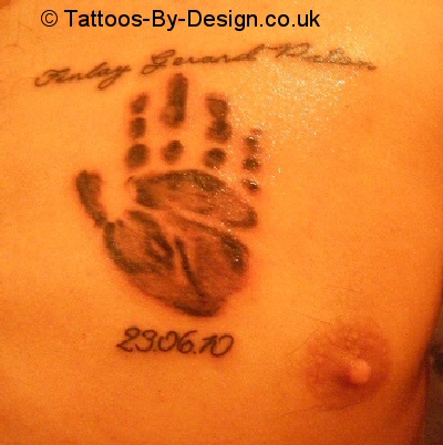 tattoo of babys handprint with name and date