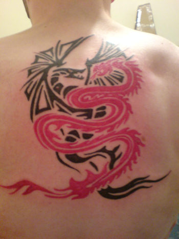 tribal dragons fighting - my first tattoo